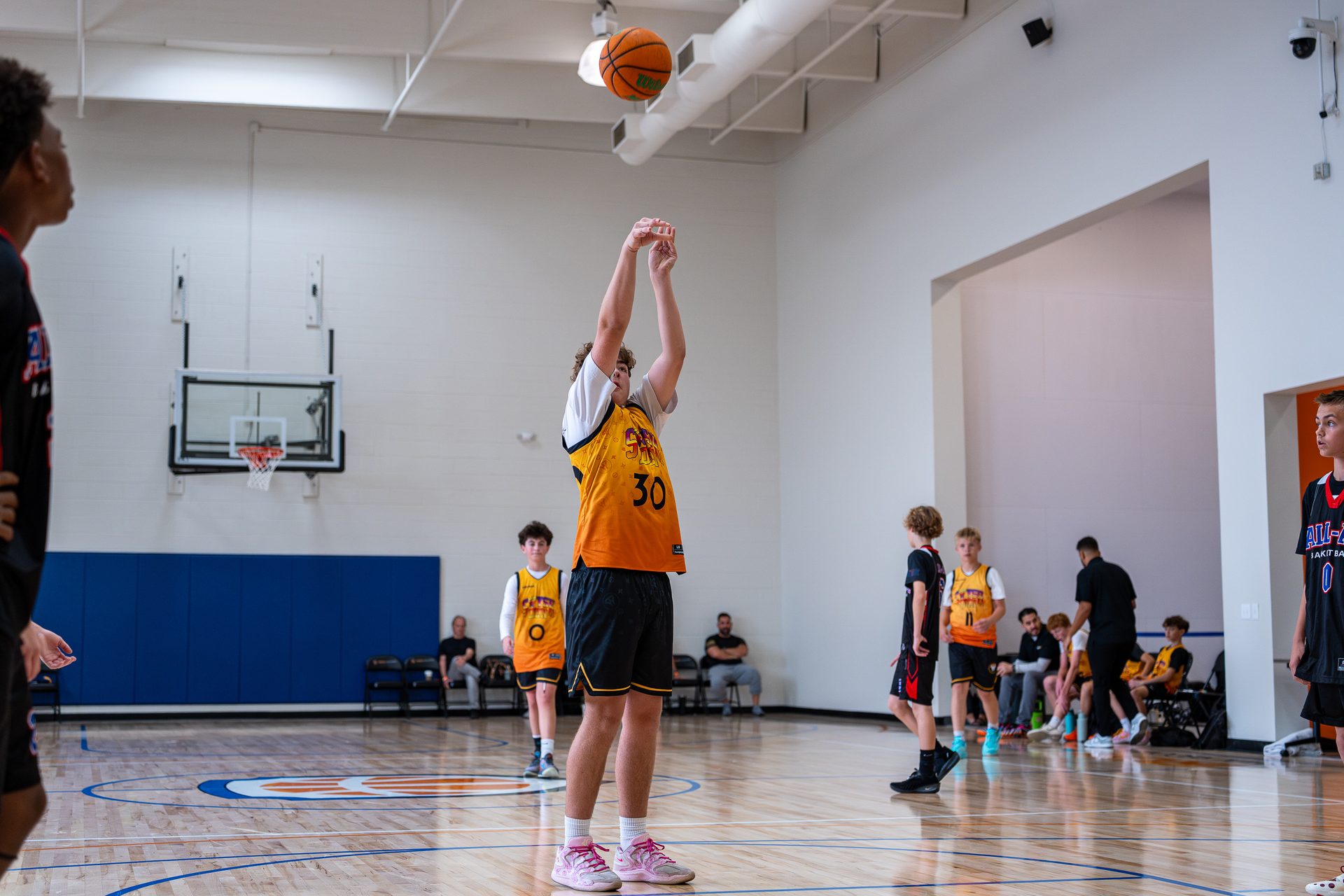 A Swysh Den Club Team player shooting a free throw in a tournament game