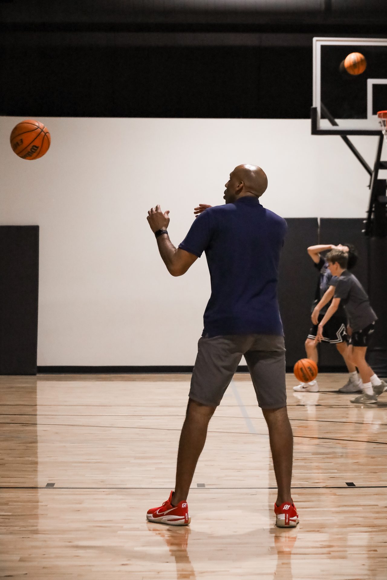Youth player working through a basketball drill on an indoor Swysh Den court in Scottsdale